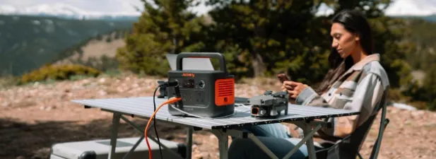 Girl Using Jackery Solar Generator 240 v2 Outdoor